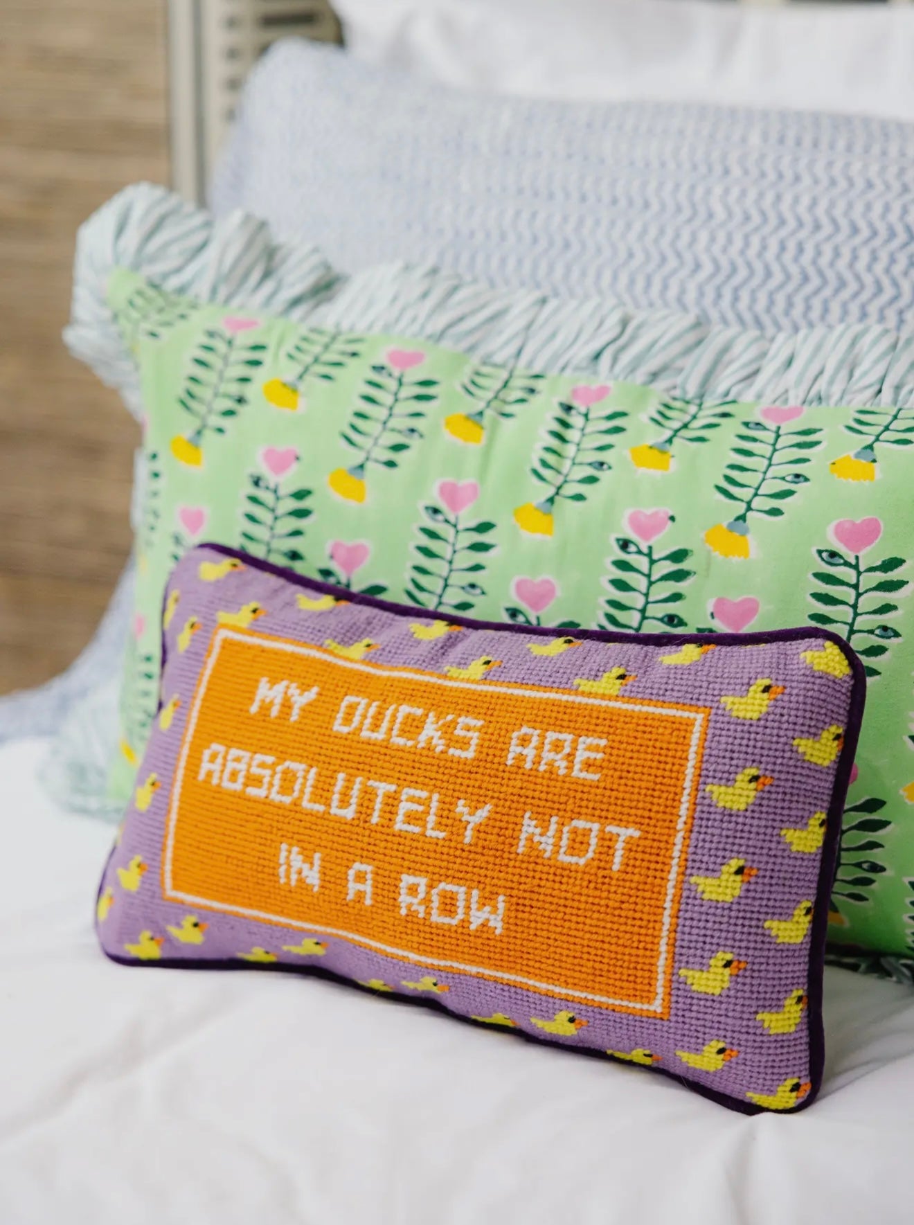 Duck in a row needlepoint pillow