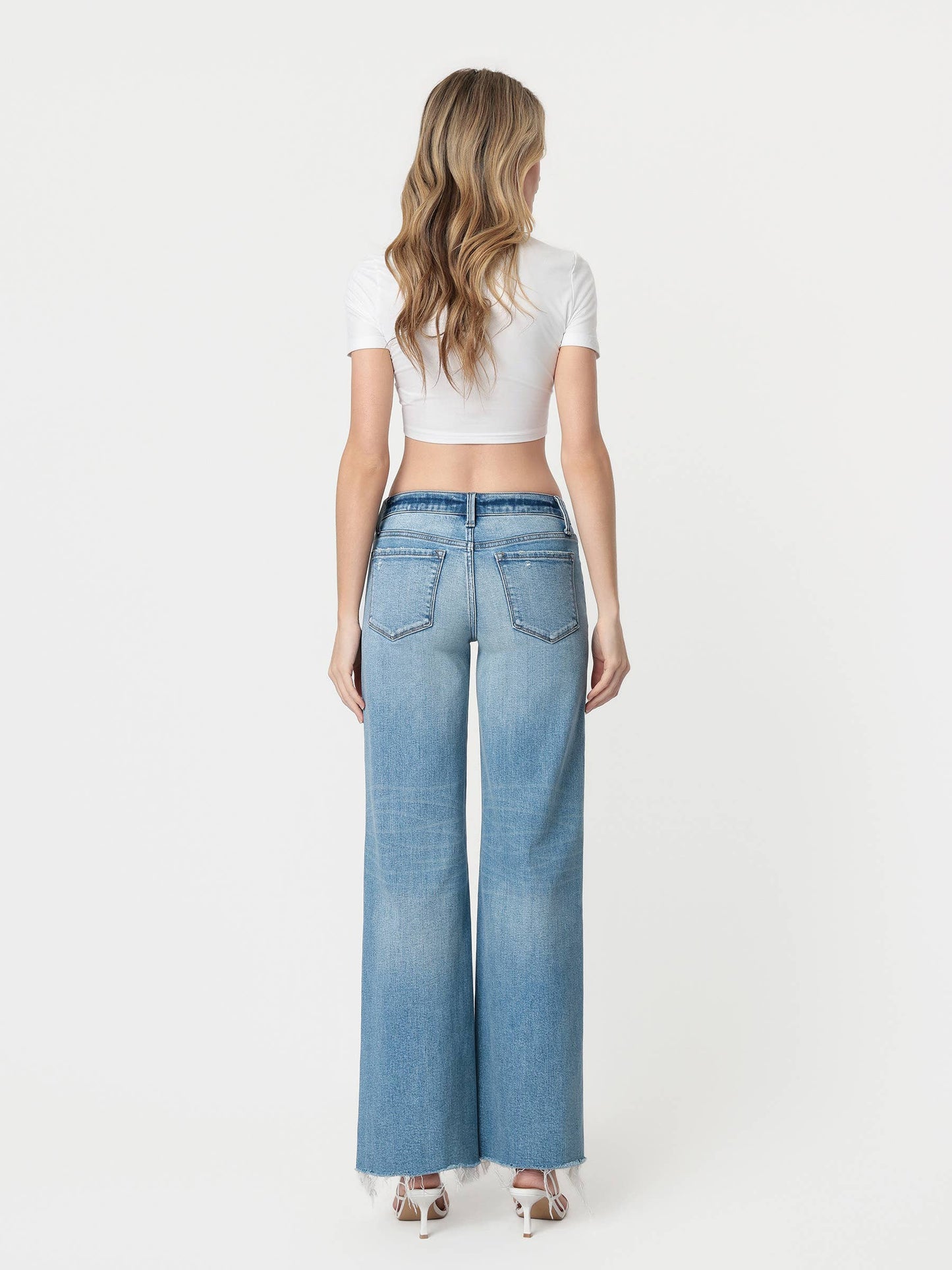 LOW RISE TINTED MEDIUM WASH WIDE FLARE JEANS