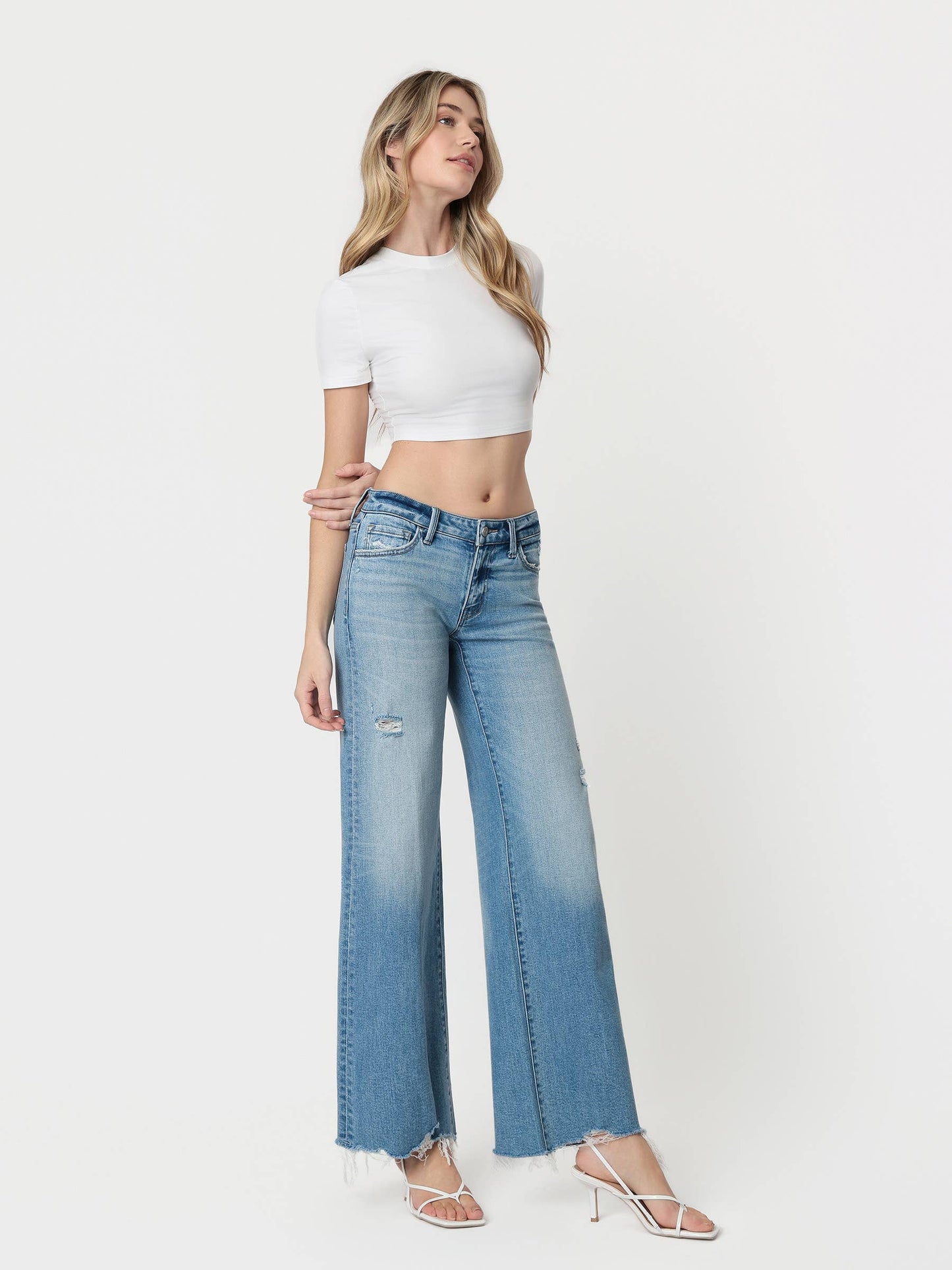 LOW RISE TINTED MEDIUM WASH WIDE FLARE JEANS