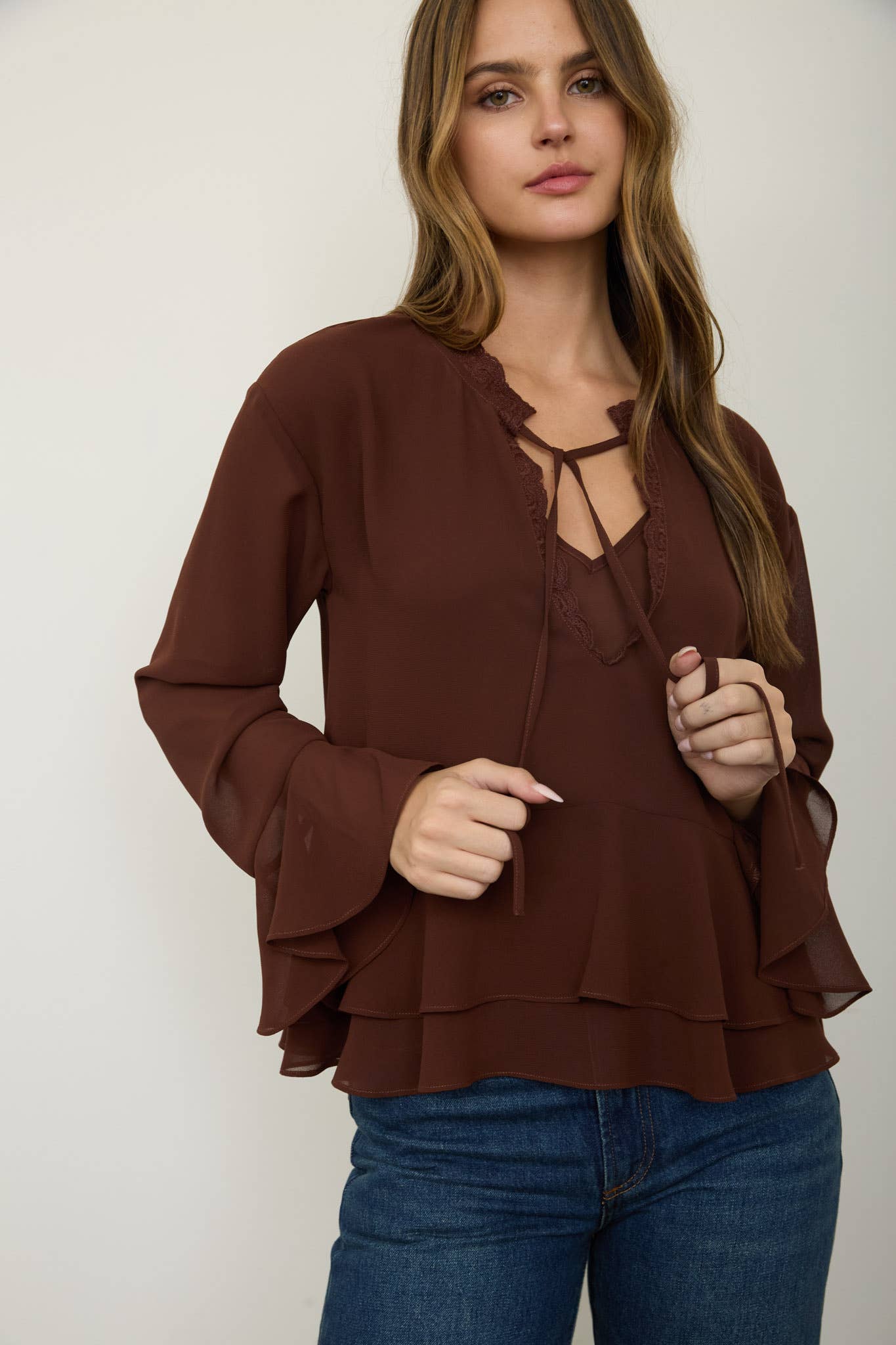 TIERED RUFFLE TIE-NECK LONG SLEEVE TOP