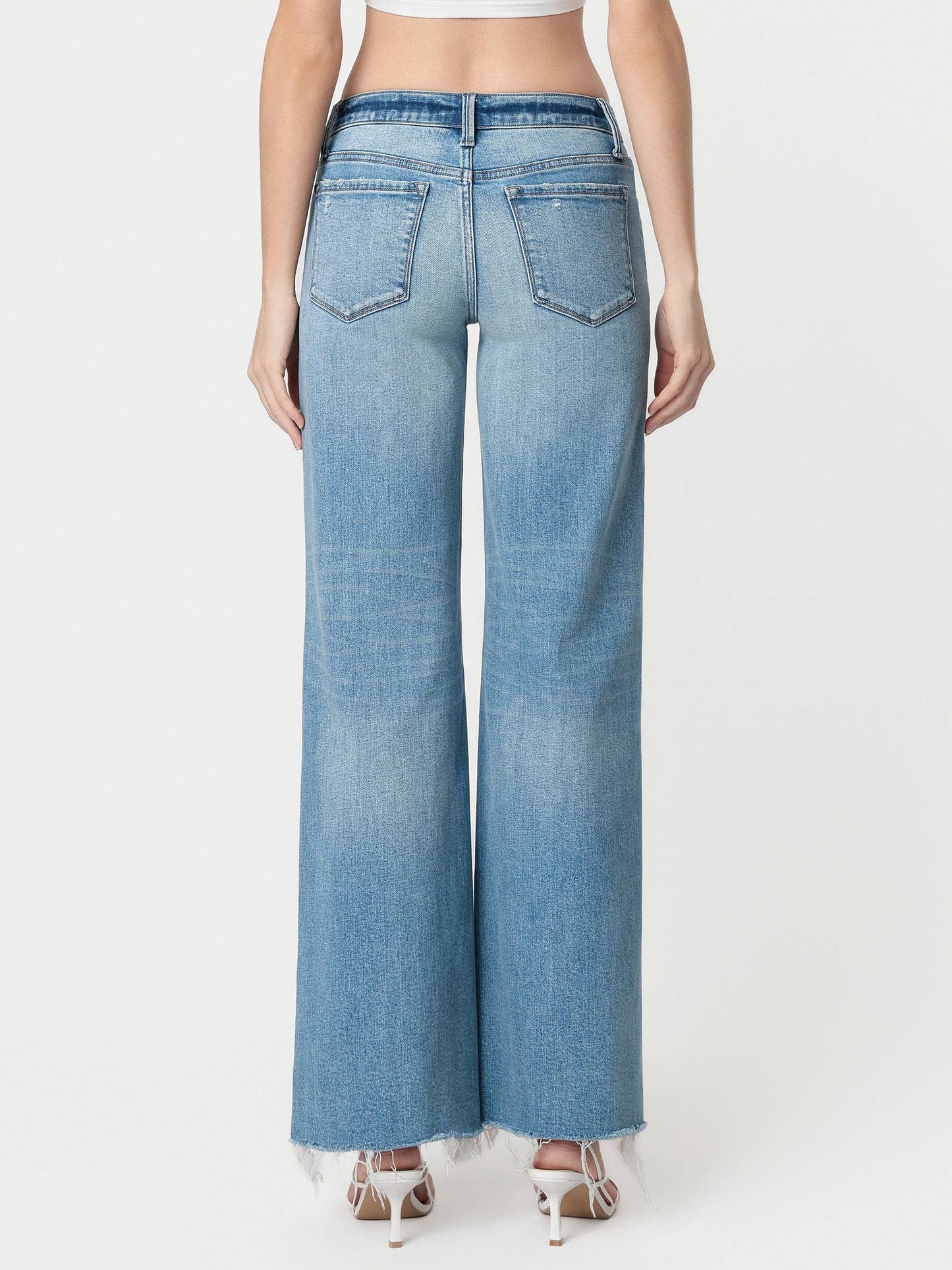 LOW RISE TINTED MEDIUM WASH WIDE FLARE JEANS